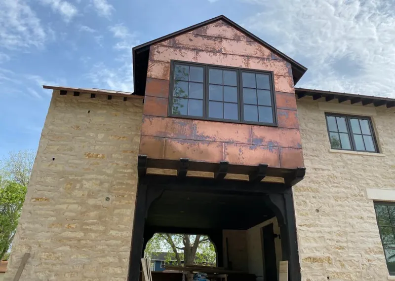 Copper metal panel facade on a stone building for Metal Roof Coating in Danville